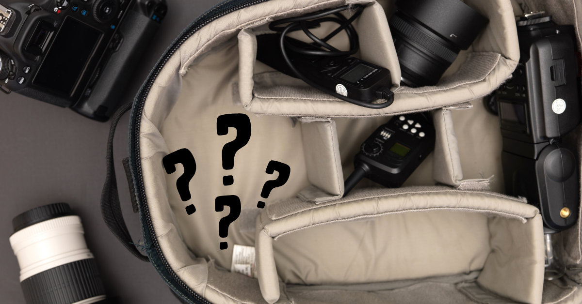 Camera bag with question marks. Photographer considering DLSR vs Mirrorless