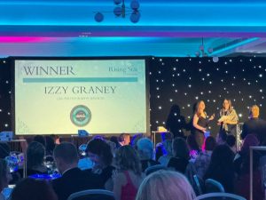 Izzy receiving her Rising Star award