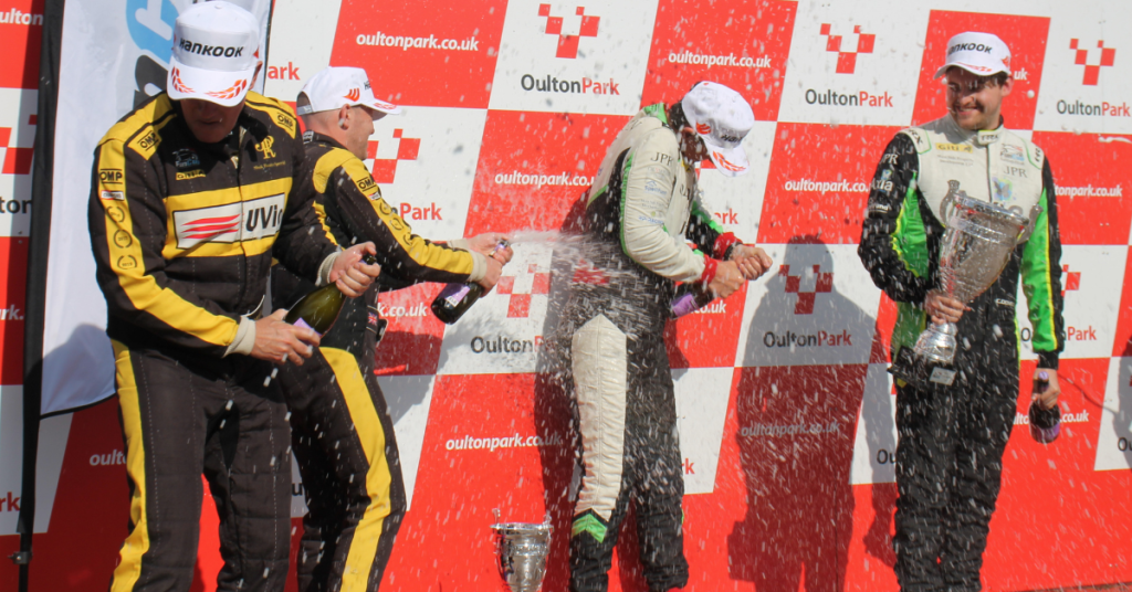 Turnaround times - Race team celebrating in the paddock after a motorsport event